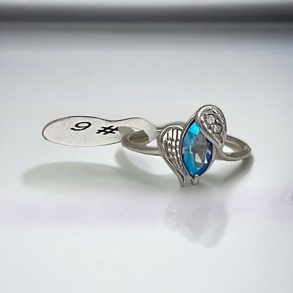 Blue Zircon gem ring by Fragrant Jewels. Silver rhodium wings with clear sparkly - Picture 2 of 3